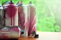 A lot of used spray cans of paint close-up. Dirty and smeared cans for drawing graffiti. The concept of a sweeping and careless d Royalty Free Stock Photo