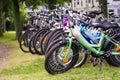 A lot of various bicycles on a grass