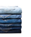 Lot of various used women jeans stacked in a pile isolated on white Royalty Free Stock Photo