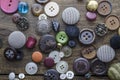 Lot of vintage buttons on old wooden table