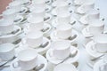 A lot of white coffee cups. Top view on many stacked in rows of empty clean white cups for tea or coffee Royalty Free Stock Photo