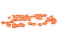 Orange pharmacy tablet isolated on white