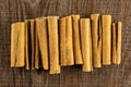 Dry brown cinnamon stick on brown wood Royalty Free Stock Photo