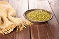 Dry green mung beans on brown wood Royalty Free Stock Photo