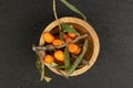 Sea buckthorn berry on grey stone