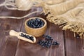 Raw black turtle beans on brown wood Royalty Free Stock Photo