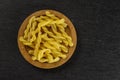 Raw pasta gemelli on grey stone Royalty Free Stock Photo