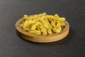 Raw pasta gemelli on grey stone Royalty Free Stock Photo