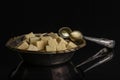 Brown sugar cube isolated on black glass Royalty Free Stock Photo