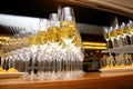 A lot of wine glasses with a cool delicious champagne or white wine at event