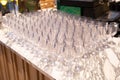 A lot of wine glasses in a row .Empty clean glasses standing in a row on a table prepared by the bartender for champagne and wine Royalty Free Stock Photo