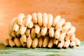 a lot of yellow bananas on the green chalkboard on the background of yellow board Royalty Free Stock Photo