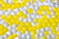 A lot of yellow and white balls. Balloons texture. Balls texture