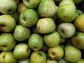 Lots of apples. Green apples. Apples on the counter in the supermarket. Background. Texture. Food. View from above. Healthy eating Royalty Free Stock Photo