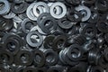 Lots of big industrial steel washers on a pile