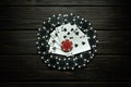 Lots of black chips and playing cards on a dark vintage table. Low key concept of luck or loss in a poker club or casino Royalty Free Stock Photo