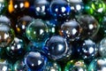 Lots of blue and green glass balls, beads on a white background, close-up Royalty Free Stock Photo