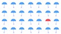 Lots of blue umbrella patterns on white background, one red umbrella with wallpaper. Royalty Free Stock Photo