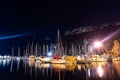 Lots of boats moored at city pier at night Royalty Free Stock Photo