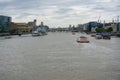 Lots of boats on River Thames London, HMS Belfast on left.