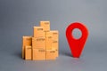 Lots of cardboard boxes and a red position pin. Locating packages and goods. Tracking parcels by the Internet. Algorithm