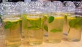 Lots of clear plastic cups with a lid and lemonade, or green tea with lemon and mint Royalty Free Stock Photo