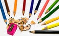 A lots of color pencil and sharpener on white background