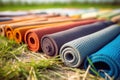 Lots of colored yoga mats on the grass. The concept of training. Generative AI
