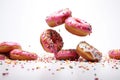 Lots of colorful donuts to eat on a white background