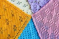 Lots of colorful hand-made crocheted scarves and kerchiefs with different patterns Royalty Free Stock Photo
