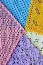 Lots of colorful hand-made crocheted scarves and kerchiefs with different patterns Royalty Free Stock Photo