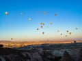 Lots of colorful hot air balloons flying over Cappadocia