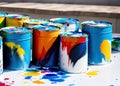 Lots of colorful paint cans splashed with multi colored paint. Painting, arts and crafts, artistic creativity and creative