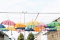 Lots of colorful umbrellas hang overhead. Creative idea