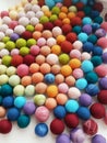 Lots of colorful wool balls. Felt for jewelry. Royalty Free Stock Photo