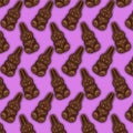 Lots of Dark chocolate hares on a pink background.