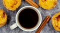 Lots of desserts Pastel de nata or Portuguese egg tart and cinnamon sticks with a cup of coffee. Pastel de Belm is a