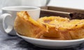 Lots of desserts Pastel de nata or Portuguese egg tart with a white cup of black coffee. Pastel de Belm is a small pie