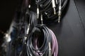 Lots of different audio and internet cables in a dark studio room Royalty Free Stock Photo