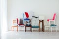 Lots of different chairs in the empty white interior room Royalty Free Stock Photo