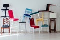 Lots of different chairs in the empty white interior room Royalty Free Stock Photo