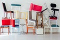 Lots of different chairs in the empty white interior room Royalty Free Stock Photo