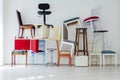 Lots of different chairs in the empty white interior room Royalty Free Stock Photo