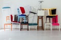 Lots of different chairs in the empty white interior room Royalty Free Stock Photo