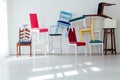 Lots of different chairs in the interior of an empty white room Royalty Free Stock Photo