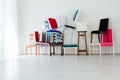 Lots of different chairs in the interior of an empty white room Royalty Free Stock Photo