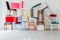 Lots of different chairs in the interior of an empty white room Royalty Free Stock Photo