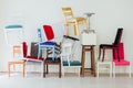 Lots of different chairs in the interior of an empty white room Royalty Free Stock Photo