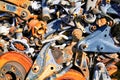 Lots of different rusty car parts piled up in a junkyard Royalty Free Stock Photo