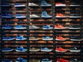 Lots of different sneakers on the showcase on market. Image of sport shoes on shop-window